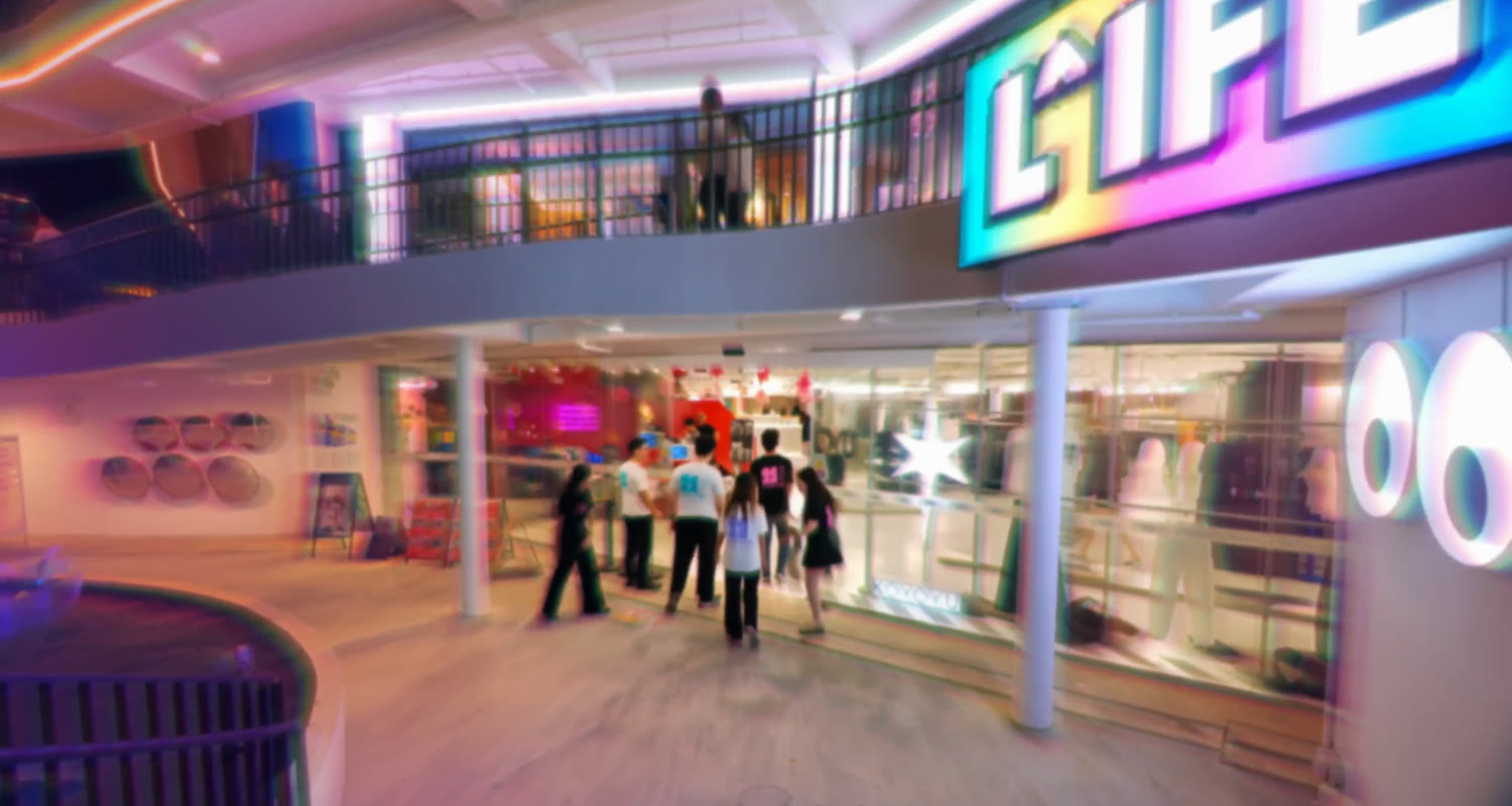 The L^IFE Singapore sign above the entrance to the creative space, from the launch film